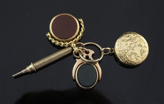 An early 20th century 18ct gold and carnelian set spinning fob,